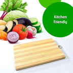 Natural wood cutting board used for serving cheese and grapes.