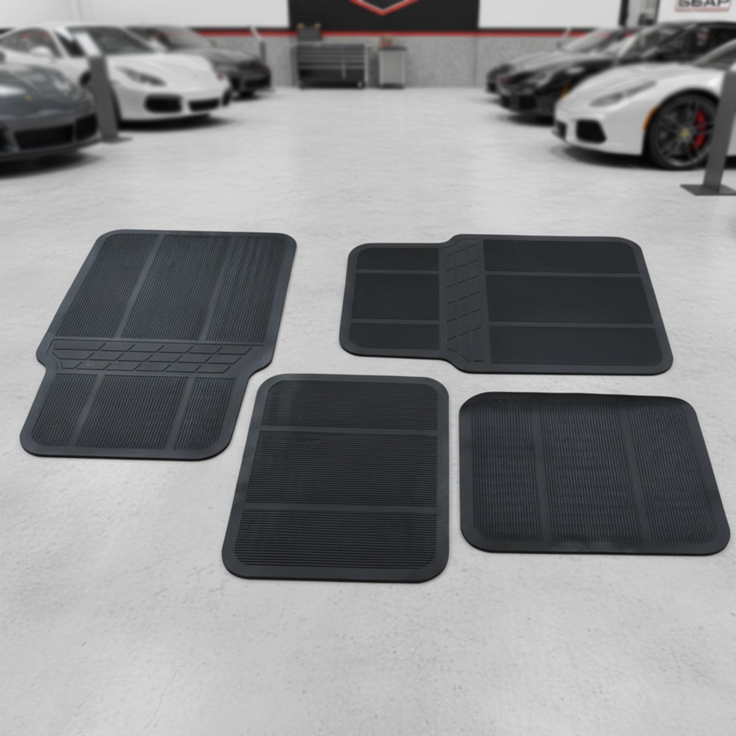 Universal vehicle floor protection mats in black rubber