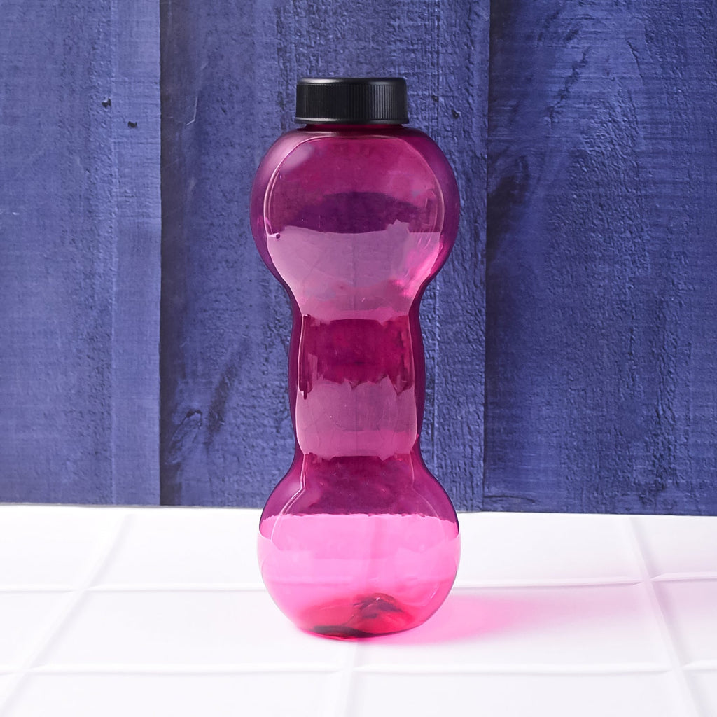 Dumbbell water bottle displayed with other gym accessories for an active lifestyle.