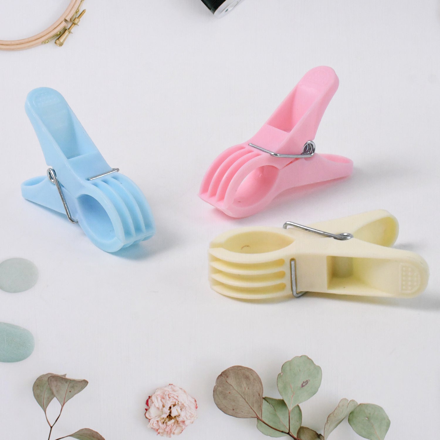 Close-up view of blue plastic cloth clip showing strong grip mechanism