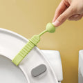 Hygienic silicone toilet seat lifter with a non-slip mushroom grip.