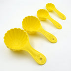 Four plastic ladoo moulds of varying sizes, showcasing their versatility for different sweets.