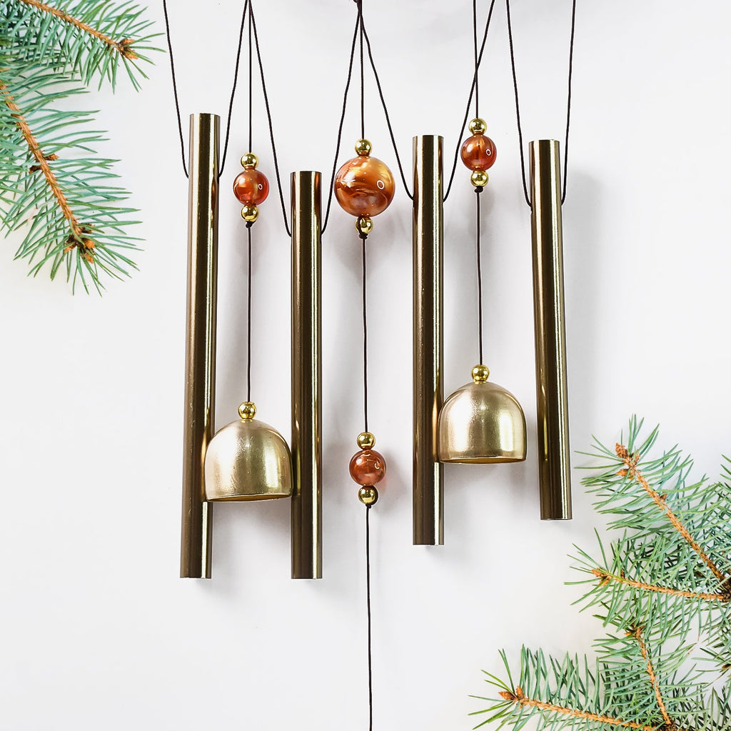 Lord Ganesh Wind Chimes displayed in garden setting creating peaceful ambiance