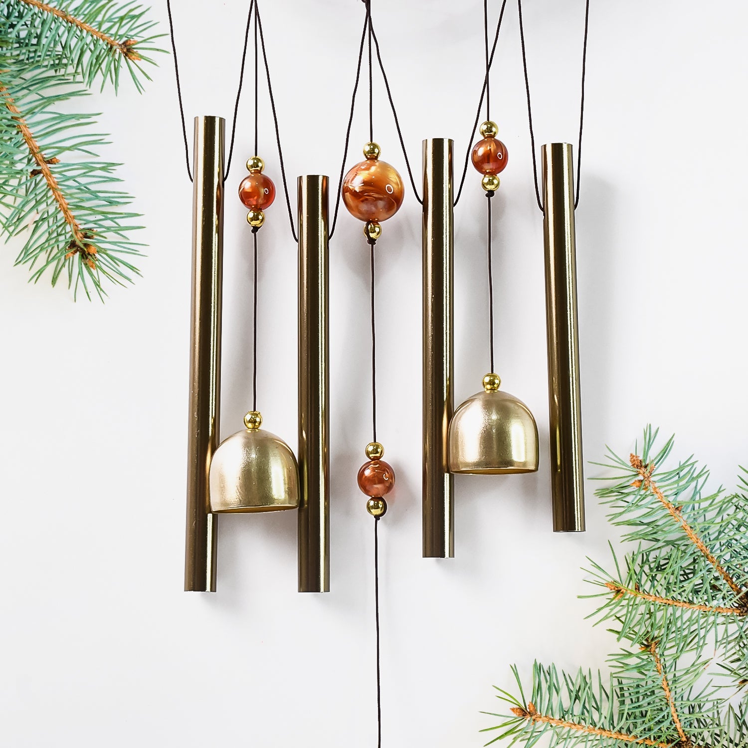 Lord Ganesh Wind Chimes displayed in garden setting creating peaceful ambiance
