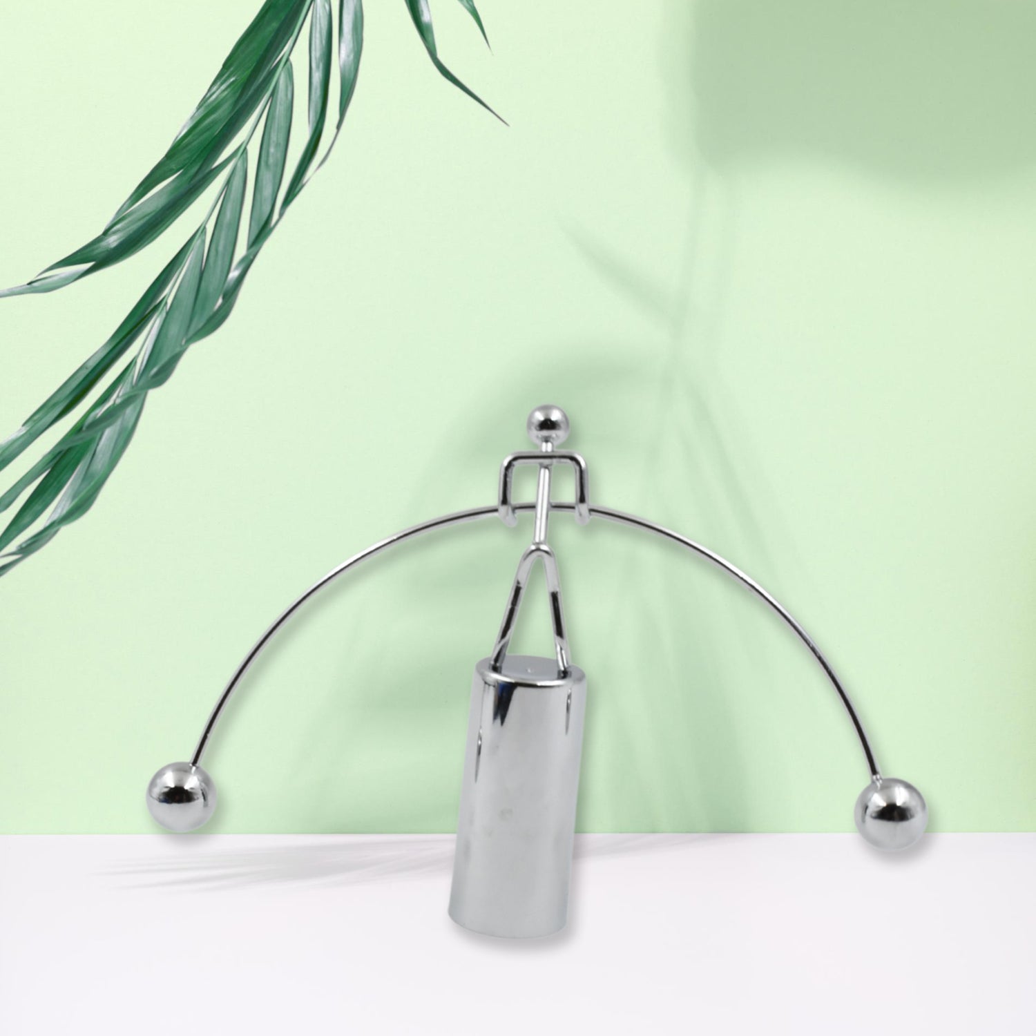 A stylish steel balance toy for desk decoration and stress relief.