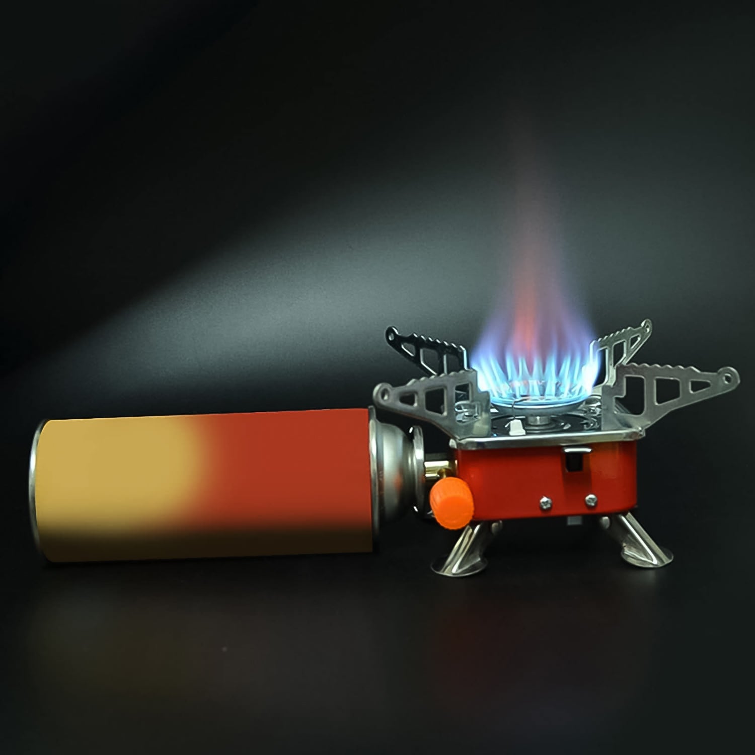 The windproof Mini Camping Stove in a natural outdoor setting, ideal for hiking and backpacking adventures.