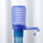 Side view of the portable water bottle pump showing its compact design.