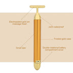 Portable gold vibrating face massager for on-the-go beauty.