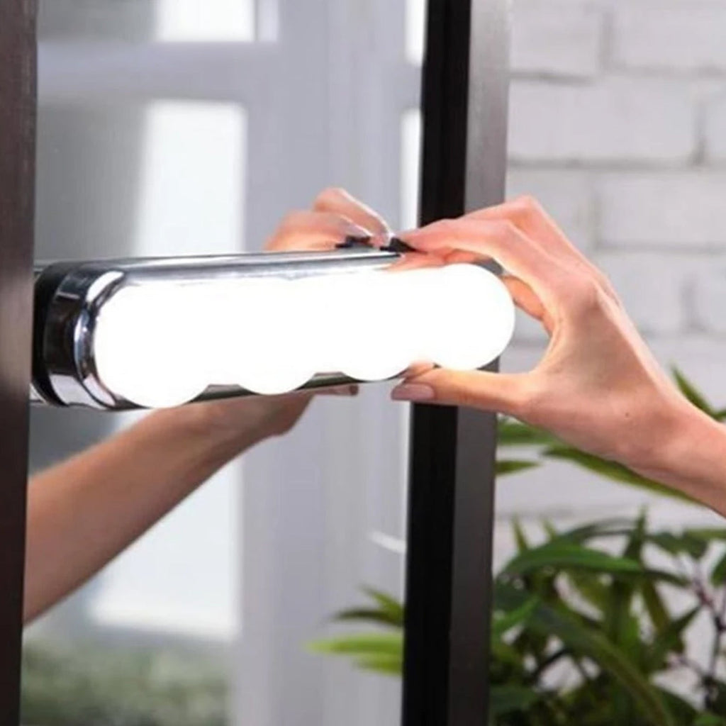 Angled shot of the battery-powered makeup light, showcasing its easy installation.