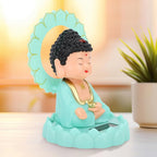 Angle view of the peaceful solar Buddha statue, ideal for home or car decor.