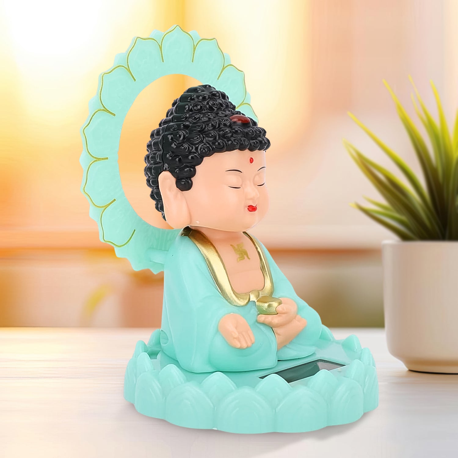 Angle view of the peaceful solar Buddha statue, ideal for home or car decor.