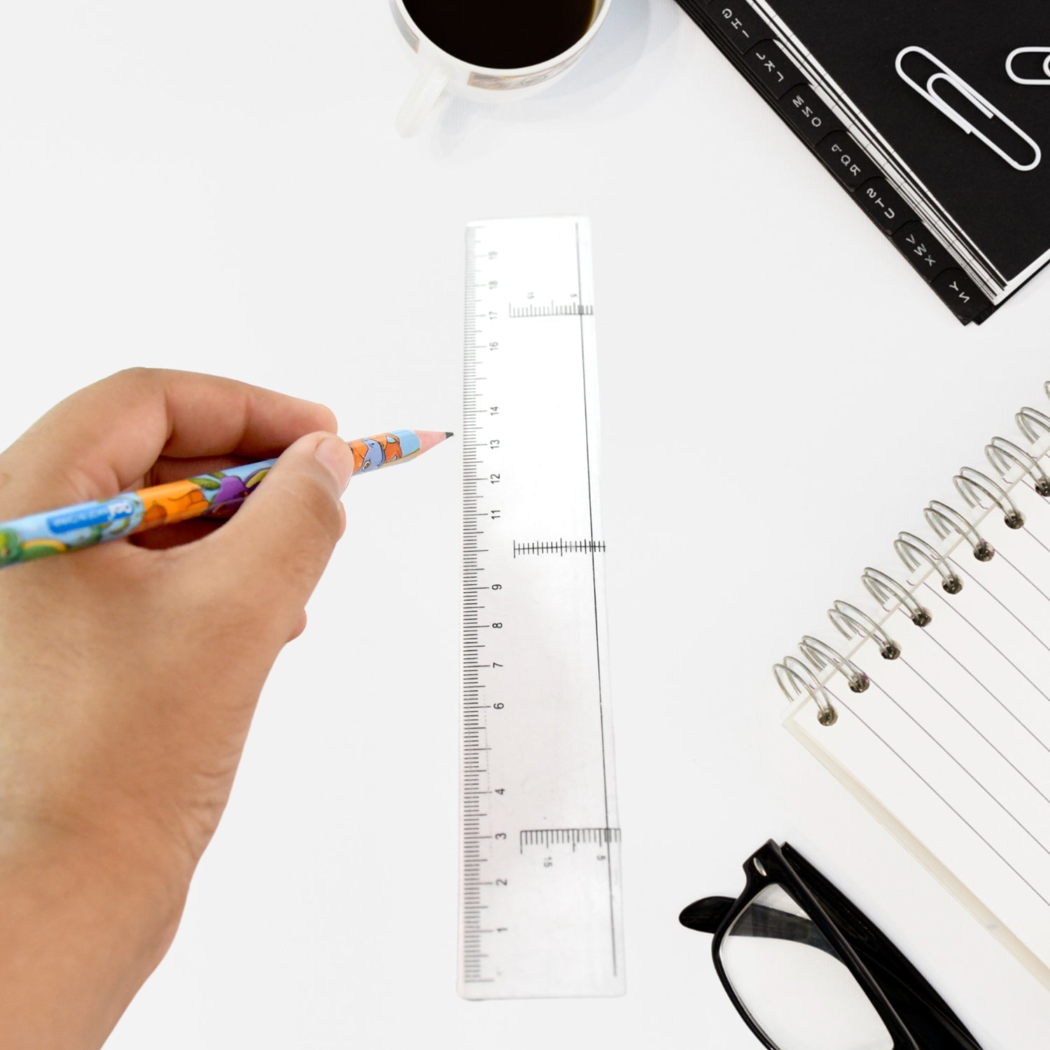 Top view of transparent plastic ruler with dual measurement scales