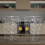 Side view of pyramid plastic glass showcasing wide stable base