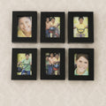 Close-up of matte black frames in the 12-piece photo frame set