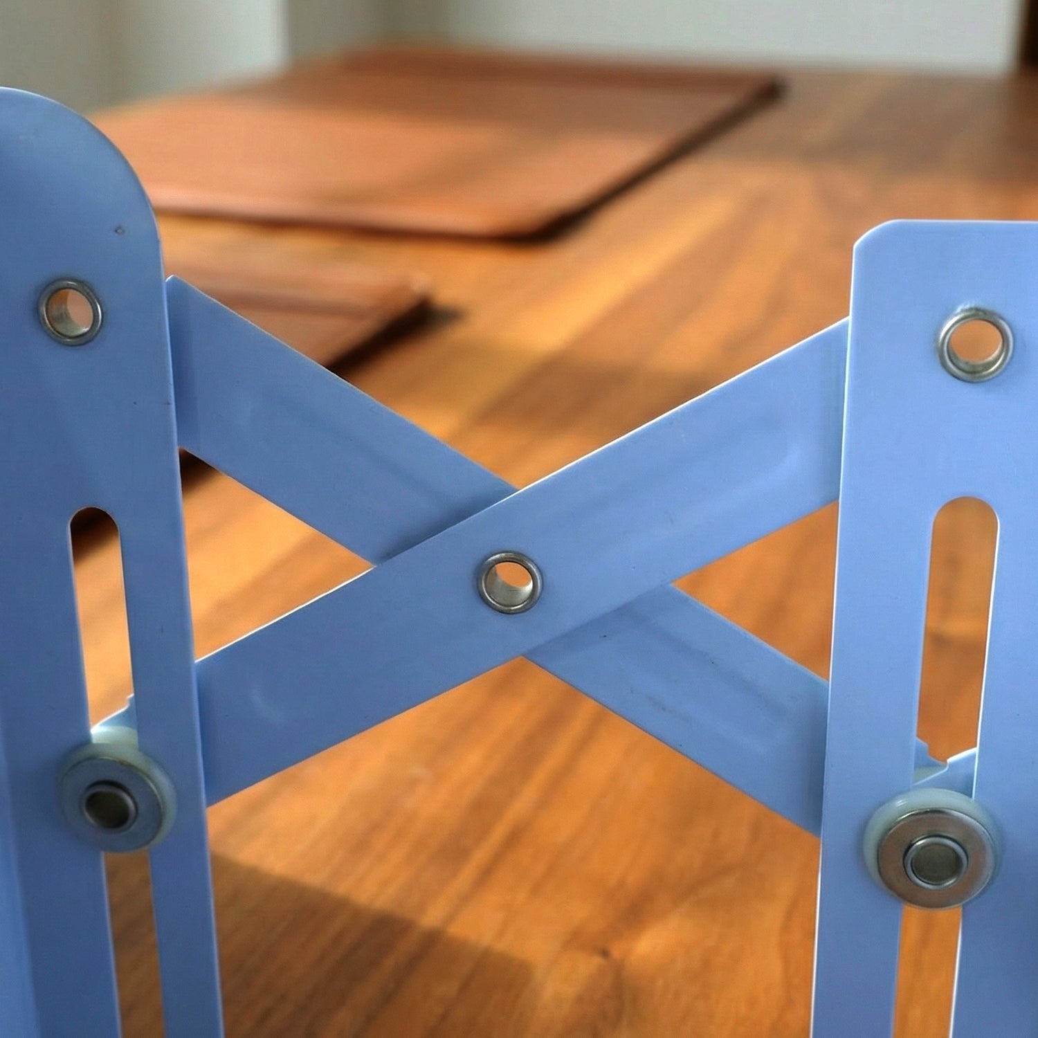 Expandable book stand organizing books and files on office shelf