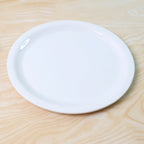 Round serving plate made of durable food-safe plastic material