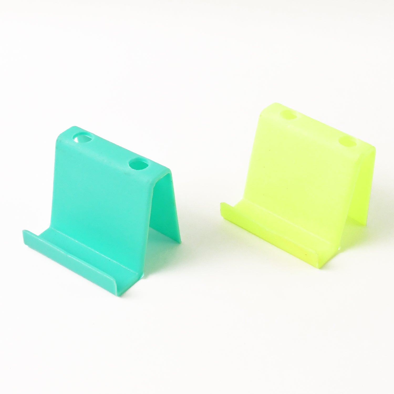 Top view of multifunctional mobile phone stand and pen holder in assorted colors