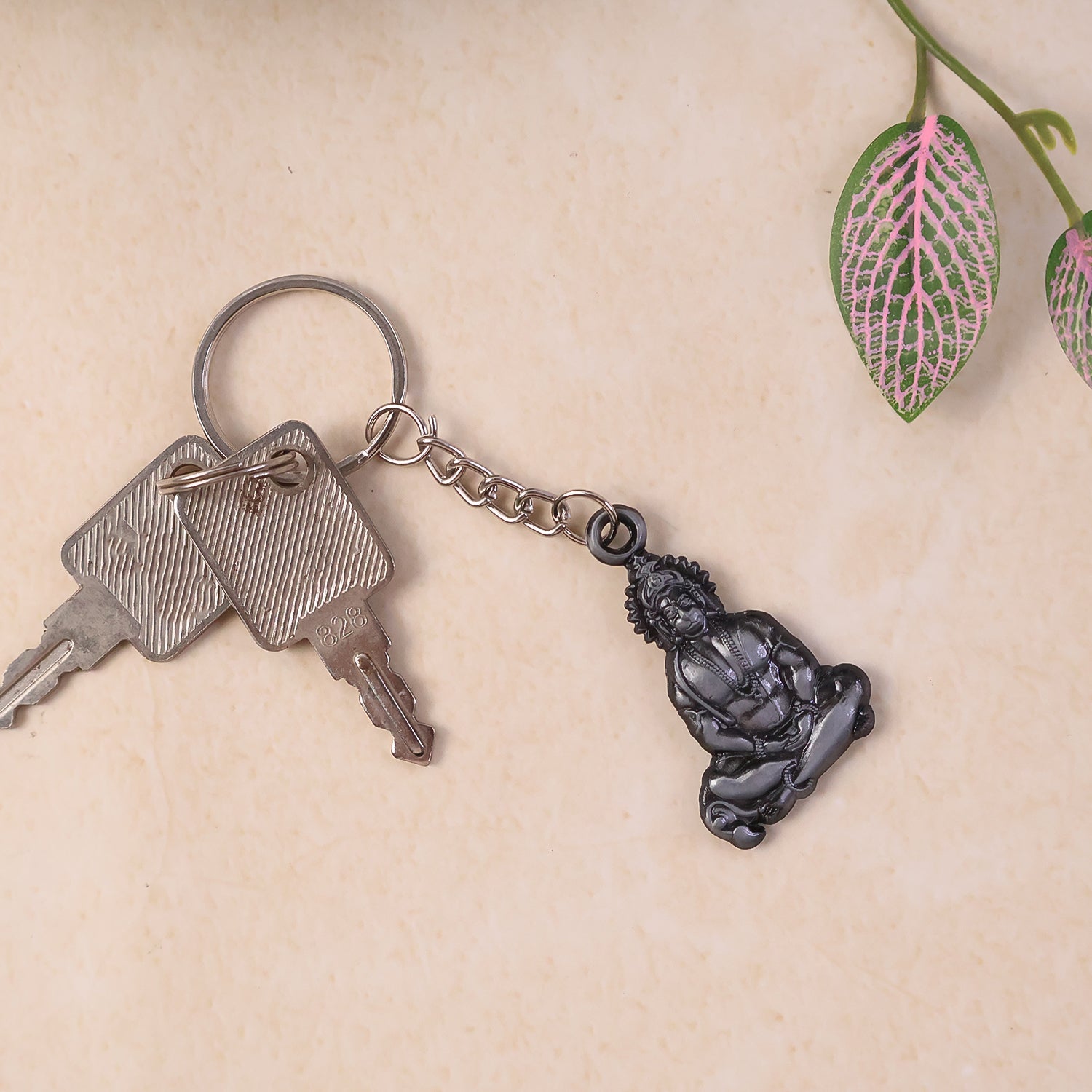 Hanuman Ji metal keychain displayed on white background