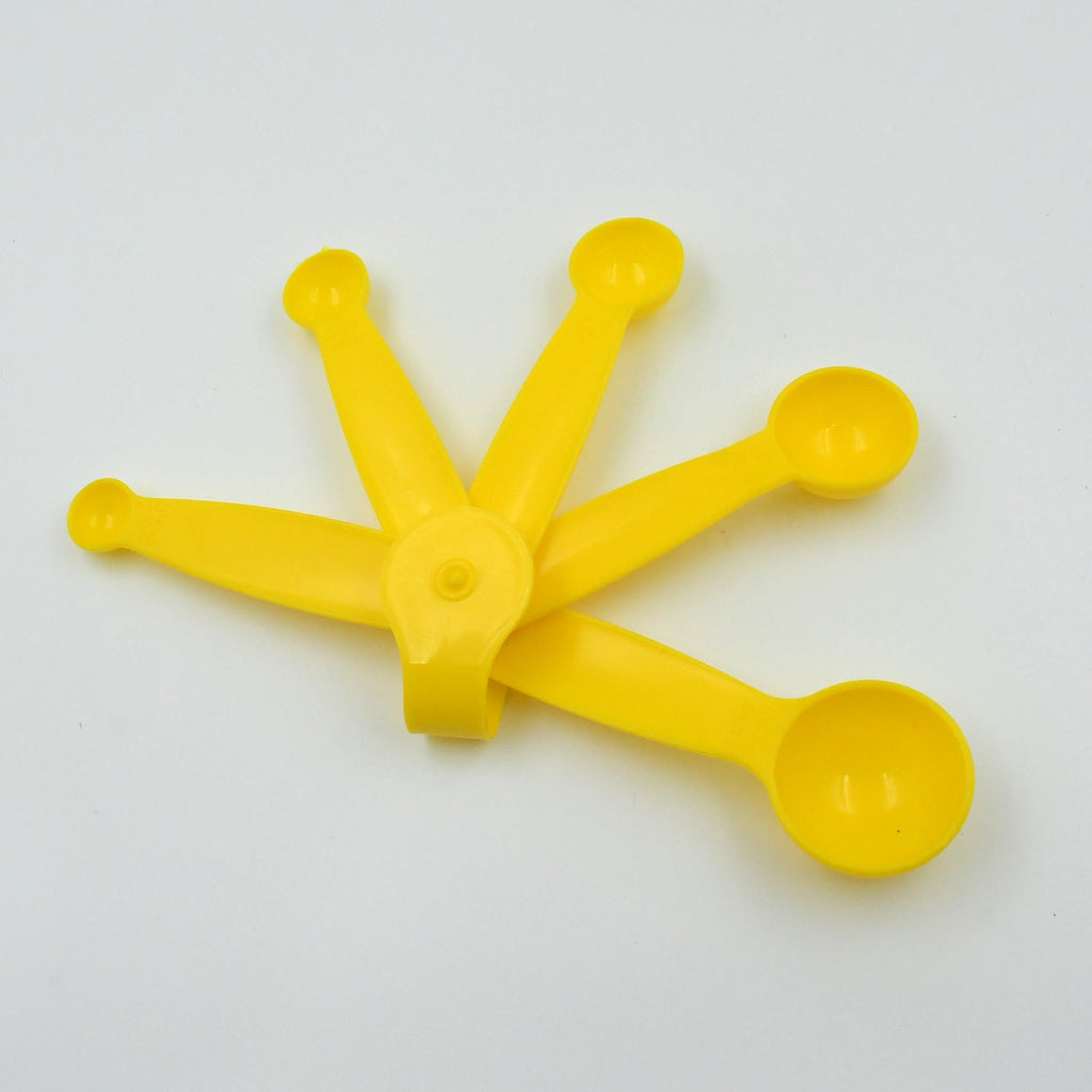 Stackable plastic measuring spoons with a convenient storage ring.