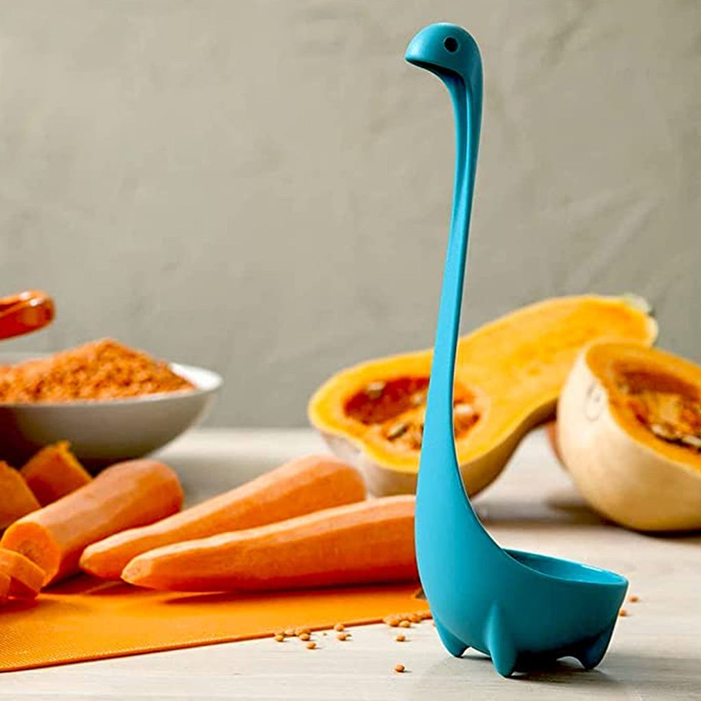 Durable silicone soup spoon resting on a modern kitchen countertop, ready for use.
