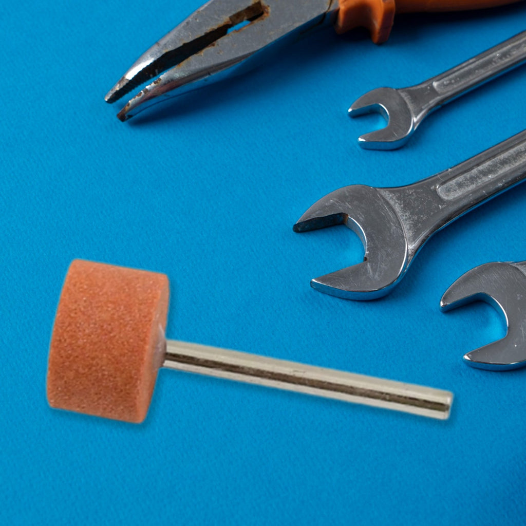 Close-up of a wool felt mounted polishing bit for intricate work.