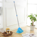 Extendable cobweb cleaner with stainless steel rod leaning on a wooden floor.