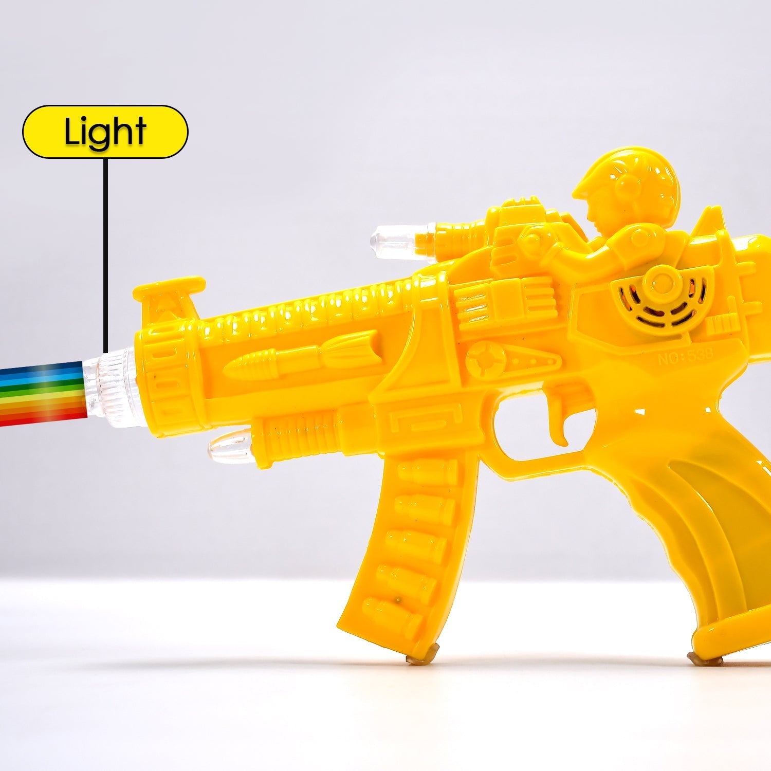 Side profile of the transparent gear toy gun, showcasing its vibrant rainbow lights.