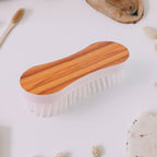 Cloth washing brush showing ergonomic curved handle and strong nylon bristles