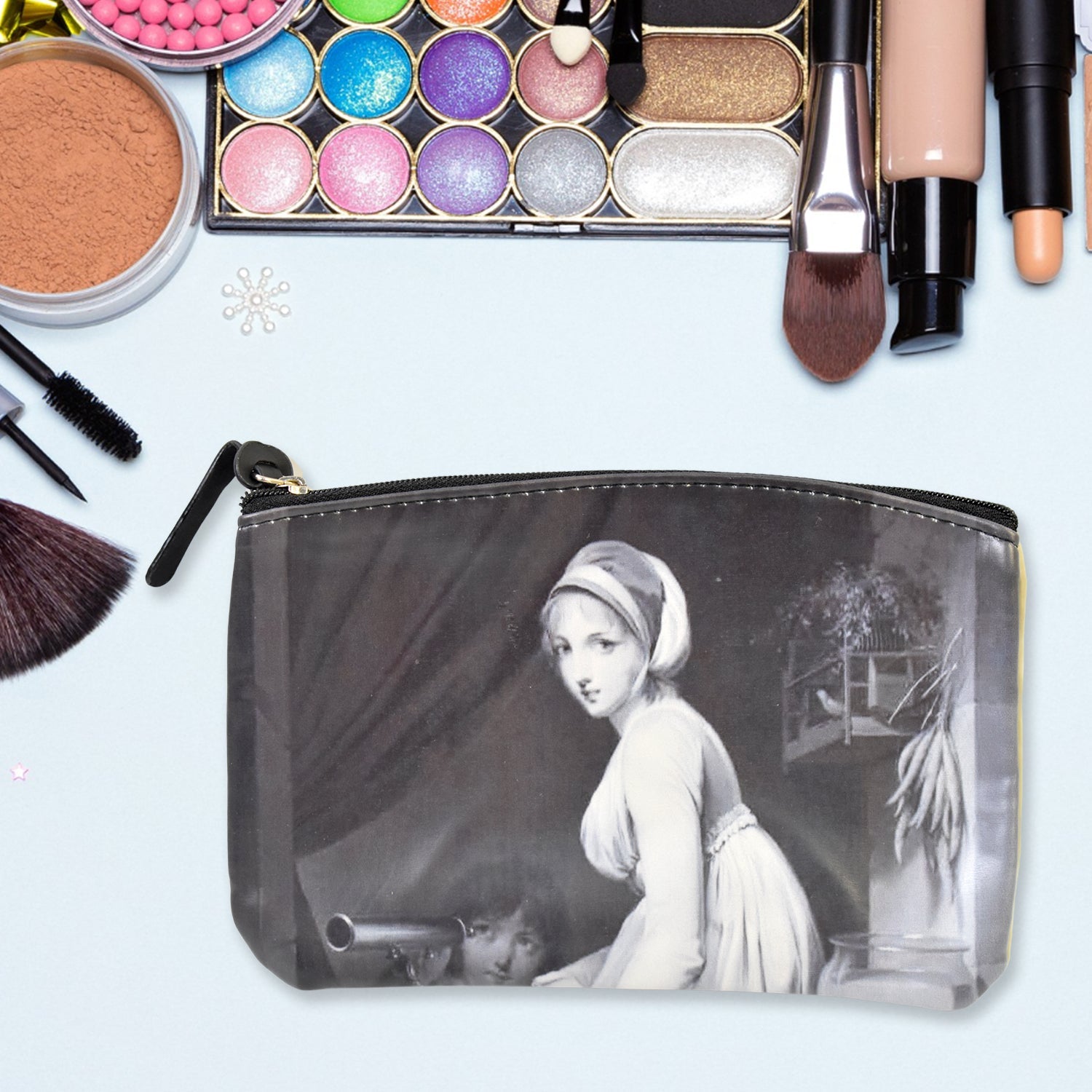 Organivo Portable Storage Bag holding small items like pens and cards.