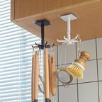 A hand demonstrating the 360-degree rotation of the self-adhesive wall hook.