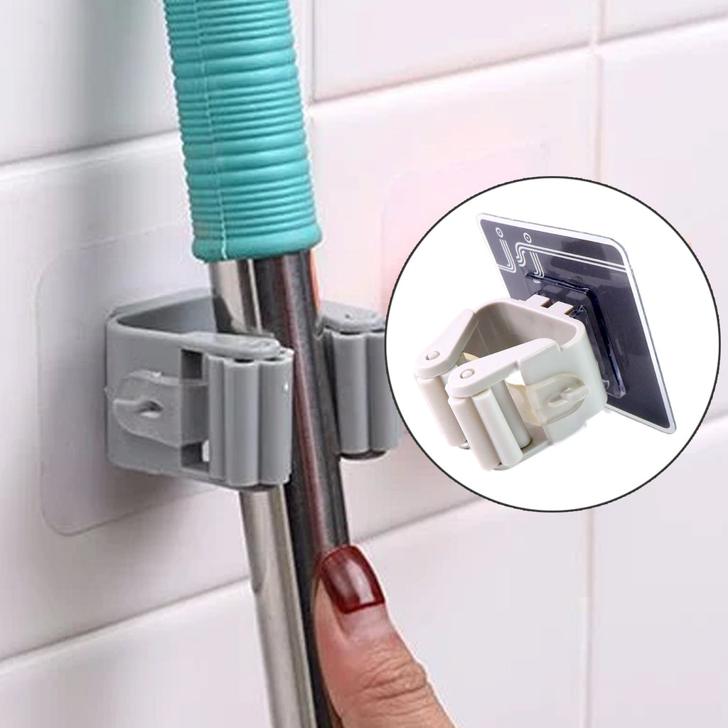 Multiple wall mounted mop & broom holders organizing various cleaning tools.