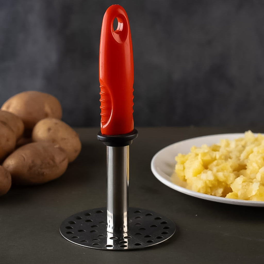 Smooth crushing action of potato masher showing ergonomic handle