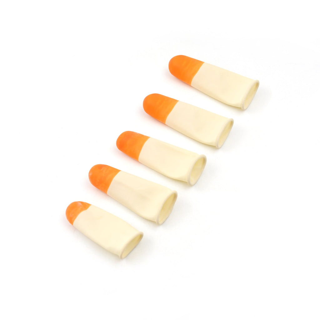 Assortment of white silicone finger protectors on a clean surface