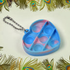 Collection of diverse mini fidget keychains in various shapes and colors, ready for everyday use.