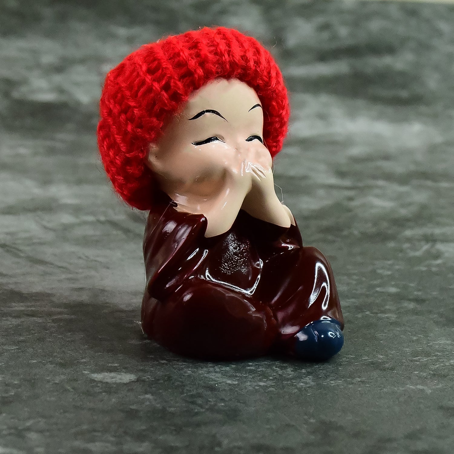 Top view of resin monk Buddha showpiece set with intricate robe designs and straw hats