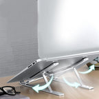The durable metal portable laptop stand is shown with an open laptop on a clean desk.