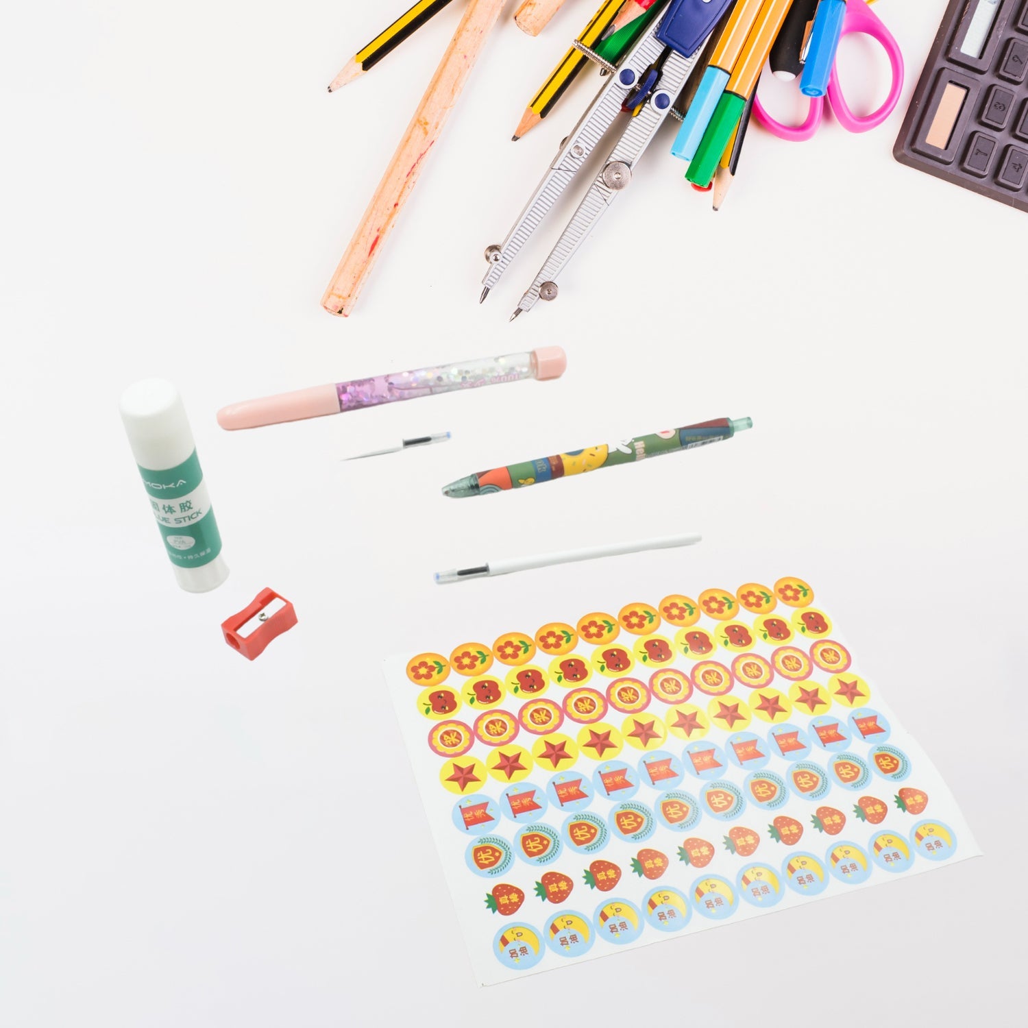 Close-up of a cartoon stationery box with a pen, eraser, and colorful graphics.