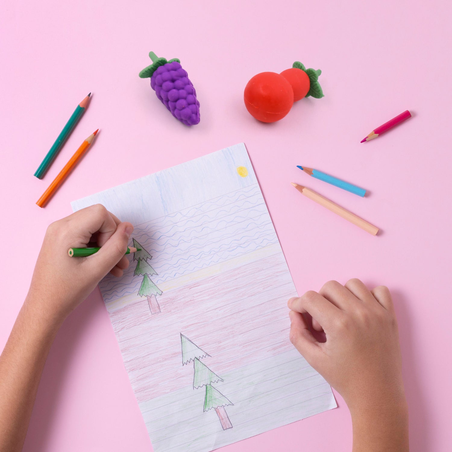 A child's hand holding a colorful 3D eraser, illustrating its comfortable size and ease of grip for young users.