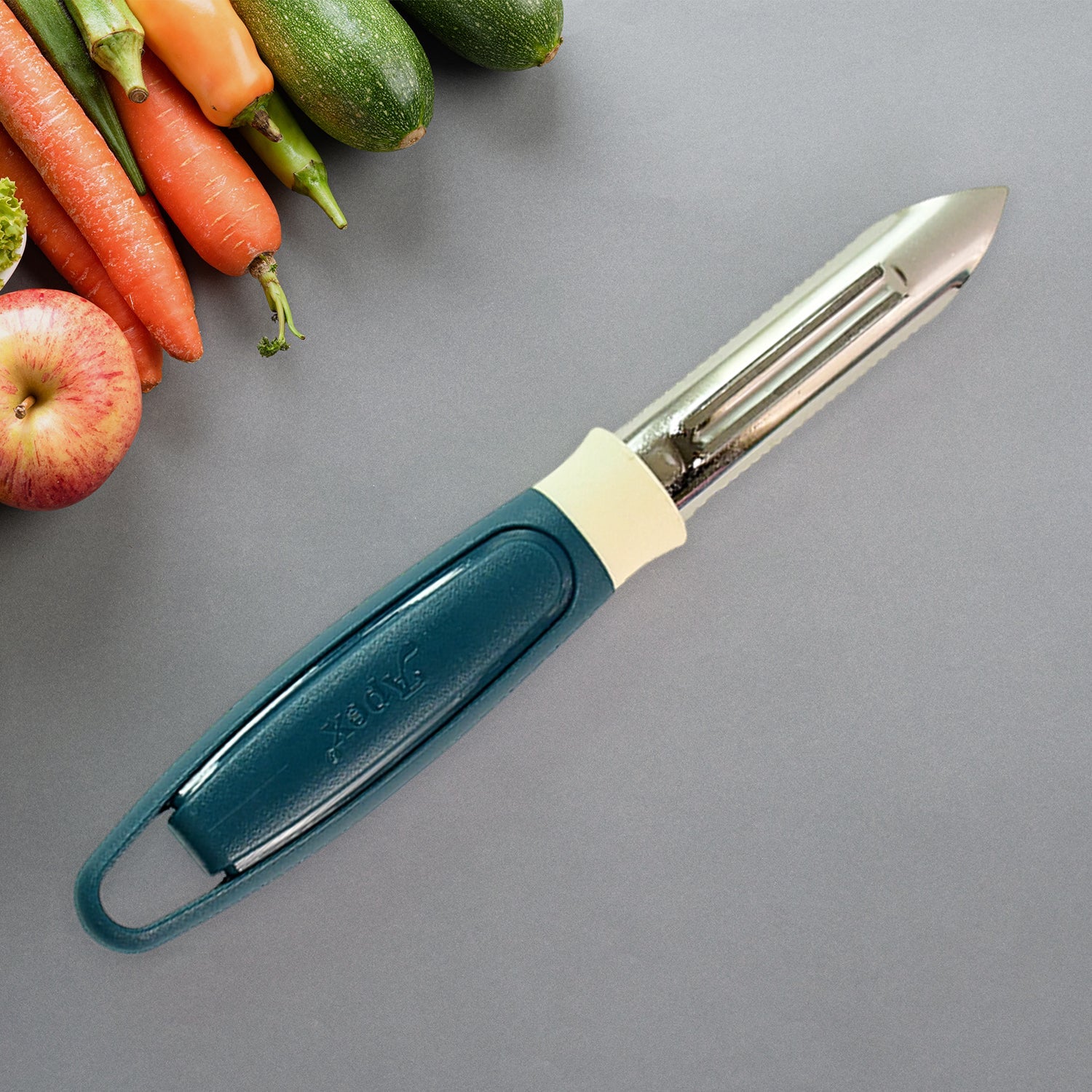 Side angle view of Apex stainless steel blade potato peeler with ergonomic handle