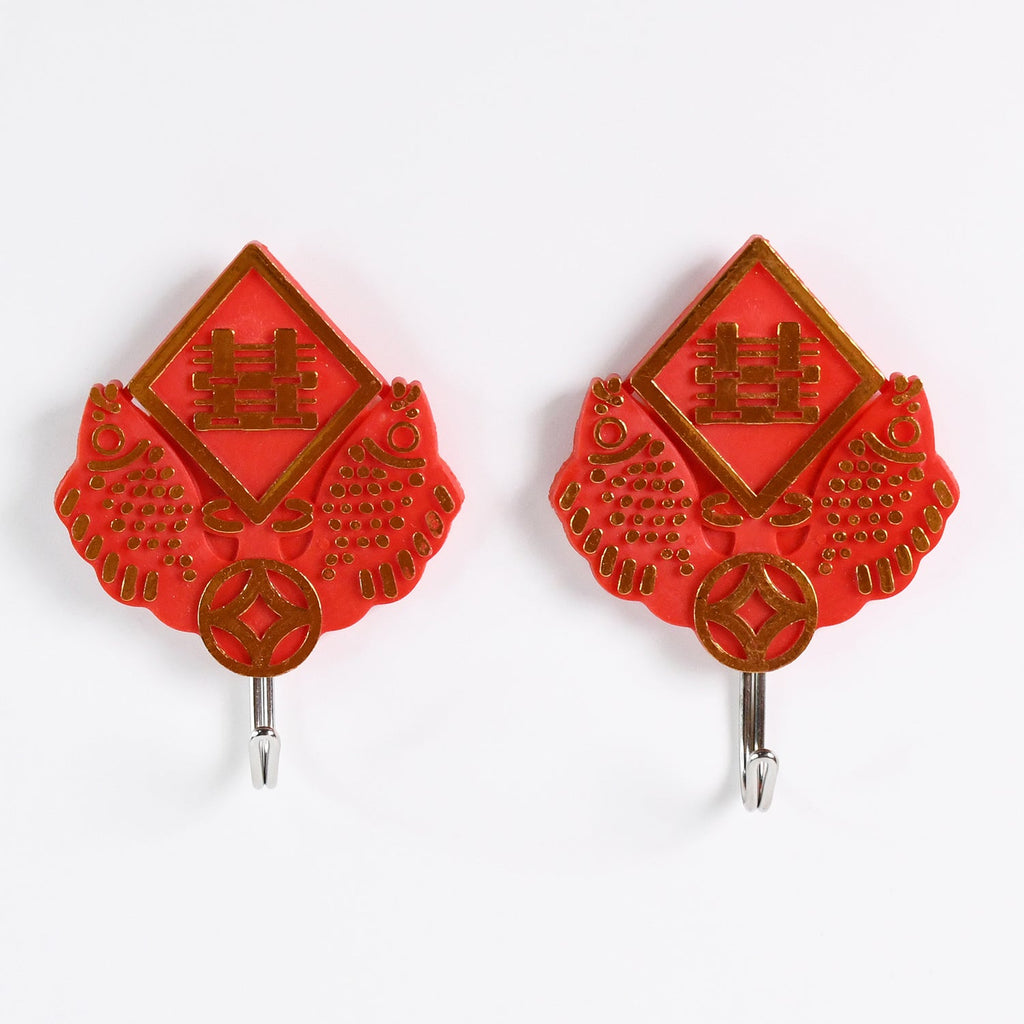Close-up of a strong self-adhesive hook securely holding a bunch of keys.