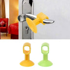 Flexible silicone door bumper guard preventing wall damage.