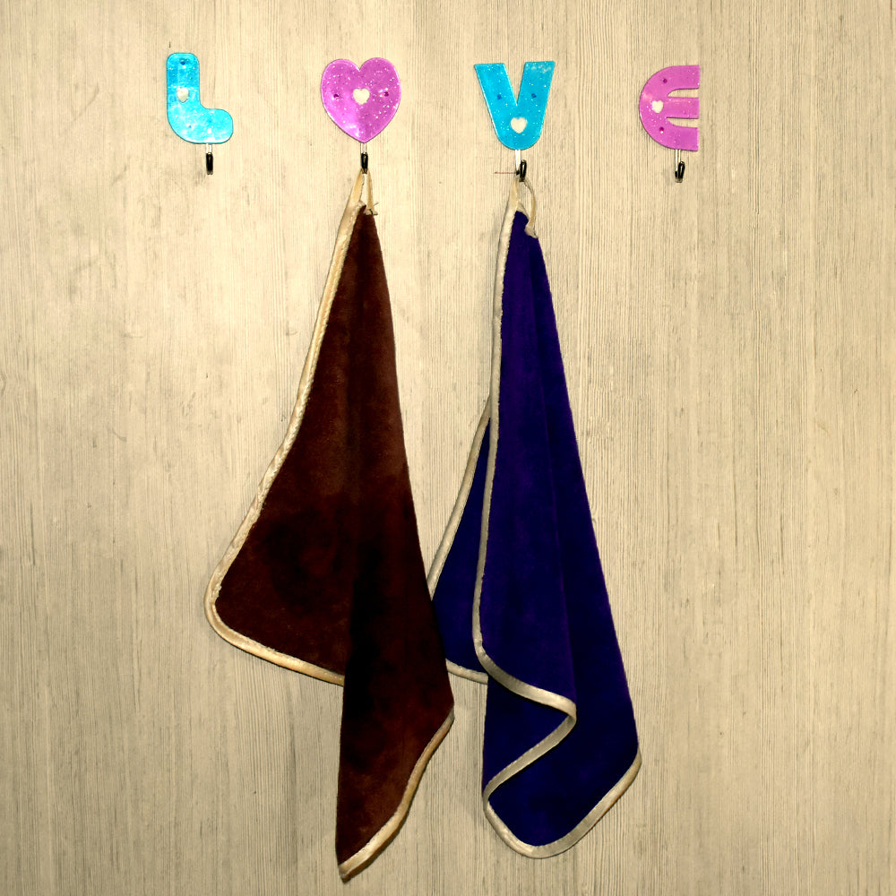 White heart-shaped self adhesive hook, ideal for hanging small items.