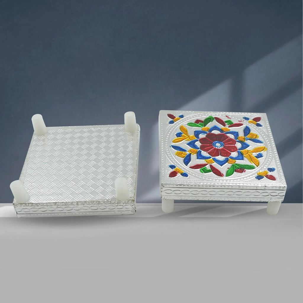 Top view of the Meenakari chowki with a small diya and puja items, ready for worship.