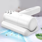 Dust Mite Controller USB rechargeable device on fabric surface