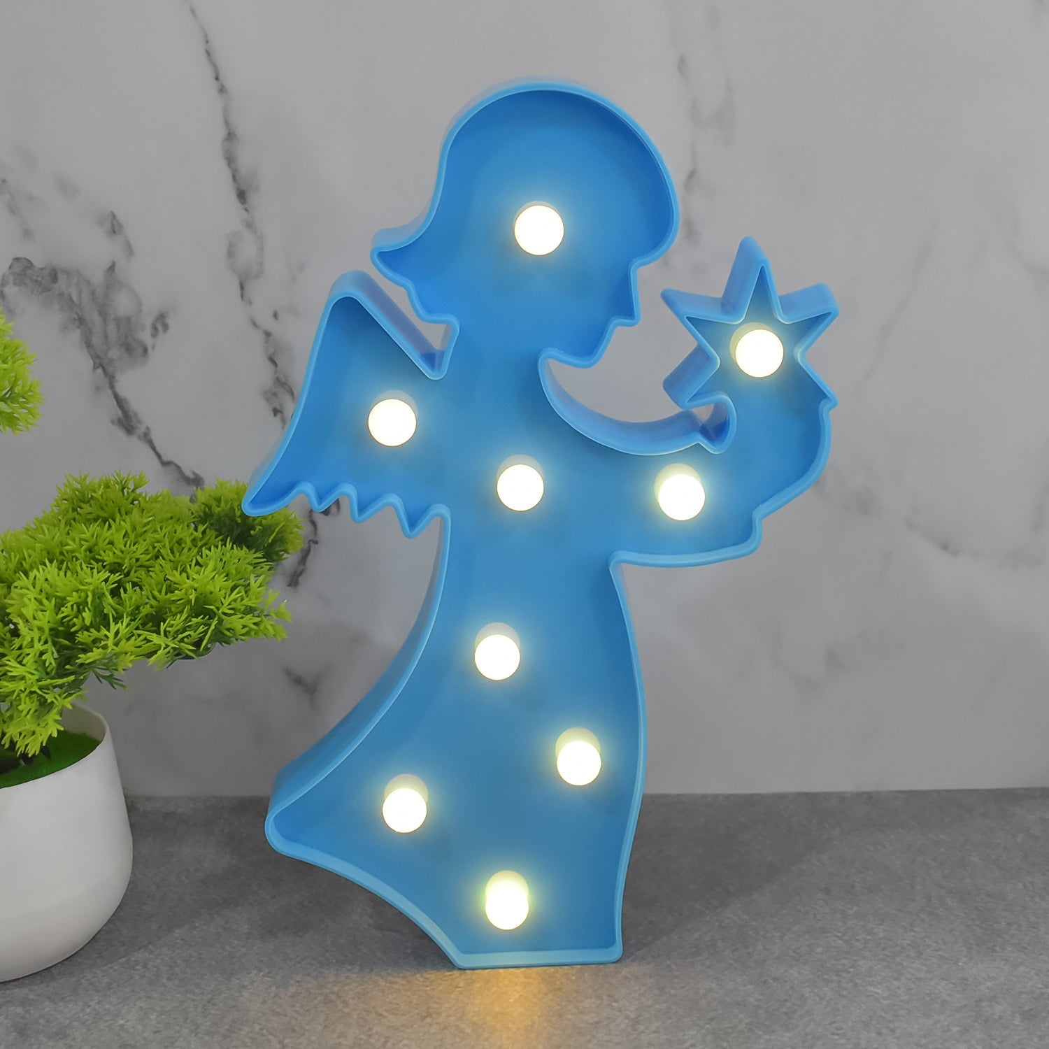 Decorative LED angel lamp on a bedside table, ideal as a thoughtful gift for girls.