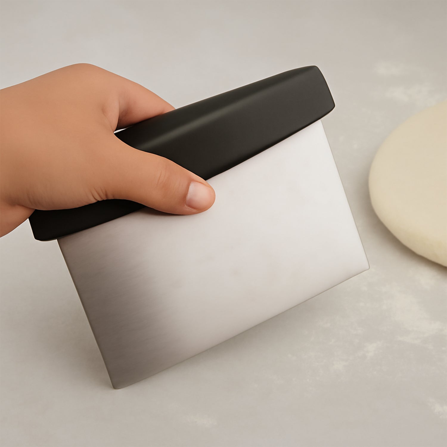 Dough scraper used for pastry, pizza, and bread preparation tasks