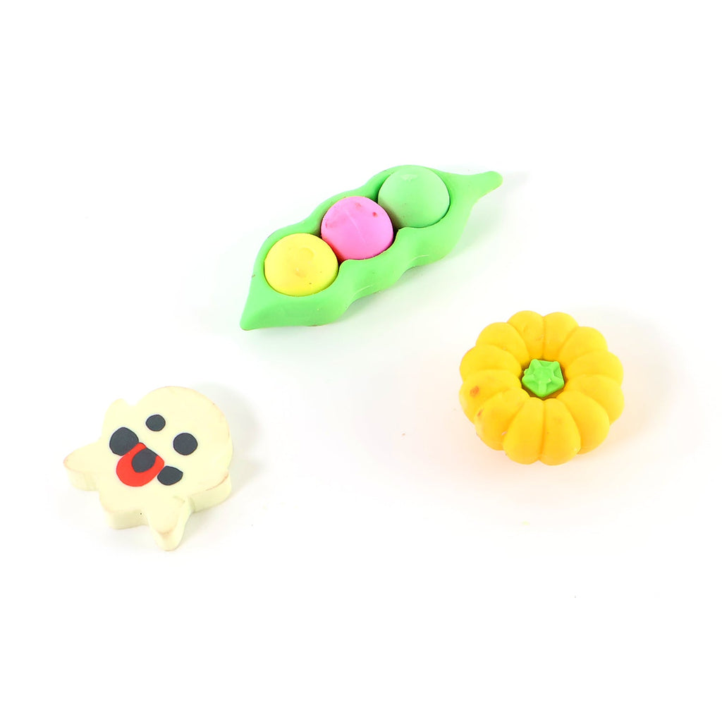 Close-up view of a vibrant orange pumpkin cartoon eraser, showcasing its detailed 3D design.