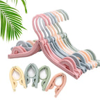 Efficient portable folding clothes hangers securely holding socks, shirts, and trousers.
