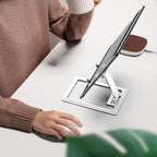 Ergonomic adjustable phone stand on a modern desk setup, enhancing productivity.