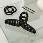 Back view of woman wearing hair claw clip holding elegant updo securely